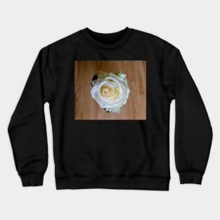 White rose on wooden background. Crewneck Sweatshirt